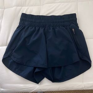 Iululemon track that high rise, 4 inch, size 4 navy blue shorts.